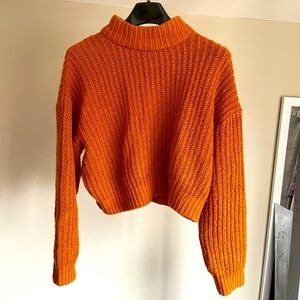 Orange chunky turtleneck sweater